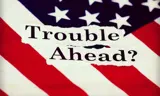 Picture of the American flag with words on top saying "Trouble ahead?"